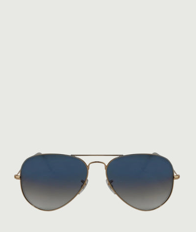 Classic aviator sunglasses with blue gradient lenses and gold metal frame