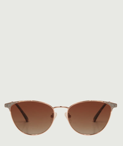 Feminine cat eye sunglasses with brown lenses and metal frame