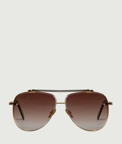 Oversized aviator sunglasses with brown lenses and gold frame. trendy and stylish