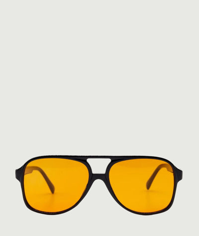 Trendy caravan style sunglasses with yellow lenses and black frame
